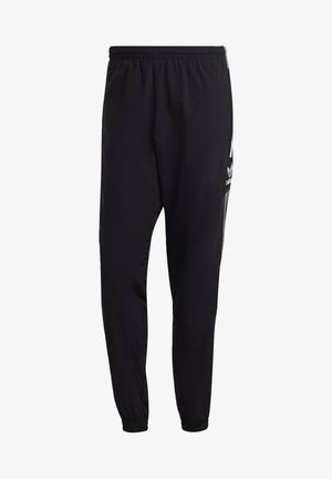 Pantalon de sport noir avec une taille élastique, des jambes fuselées et des bandes blanches sur les côtés arborant la marque. Confectionné en tissu léger et texturé.
