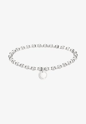 Bracelet perlé argenté avec un petit pendentif rond gravé "LIEBESKIND" sur fond blanc.