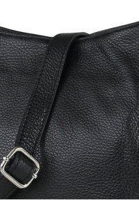 Black leather handbag with a textured finish, featuring a long strap and a silver metal buckle detail.