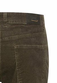 Brown corduroy pants with a textured finish, featuring a black "Camel Active" label on the waistband and a rear pocket design.