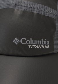 Black Columbia Titanium jacket with textured fabric, featuring gray accents and the Columbia logo prominently displayed.