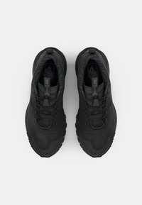 Pair of black high-top Vans sneakers with thick soles and toggle laces, viewed from above on a white background.