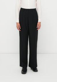 Black wide-leg trousers made from a smooth fabric, featuring a pleated design, with a high waist and subtle front creases.