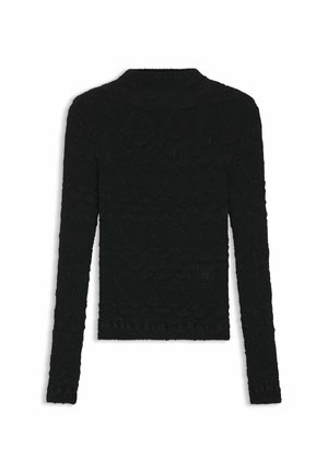 Svart tröja med långa ärmar, texturerat tyg med ett geometriskt mönster och hög halsringning. Avslutad fåll med en subtil volangdetalj.