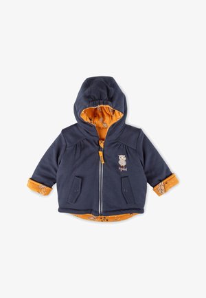 Navy blue toddler jacket with hood, orange leaf and star pattern lining, owl embroidery, front zipper, and two snap flap pockets.