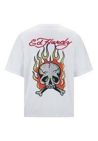 White cotton t-shirt featuring a colorful skull and flames graphic on the back, with "Ed Hardy" in red cursive above the design.