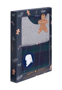 Dames grijs langemouwen top en groene geruite broek pyjama set in een feestelijk themadoos met peperkoek- en zuurstokdecoraties.