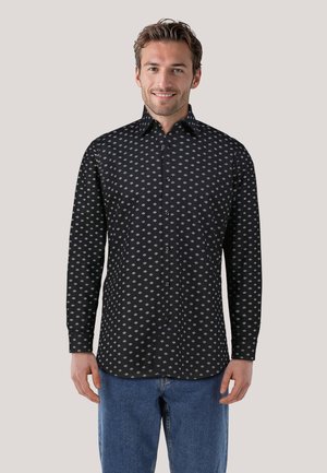 Black button-up shirt featuring a small white diamond pattern, long sleeves, and a classic collar. Worn with blue denim jeans.