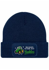 Navy knit beanie with a folded cuff, featuring a green tractor graphic and white text on a rectangular patch. Text reads "Mir reicht's ich fahr jetzt Traktor."