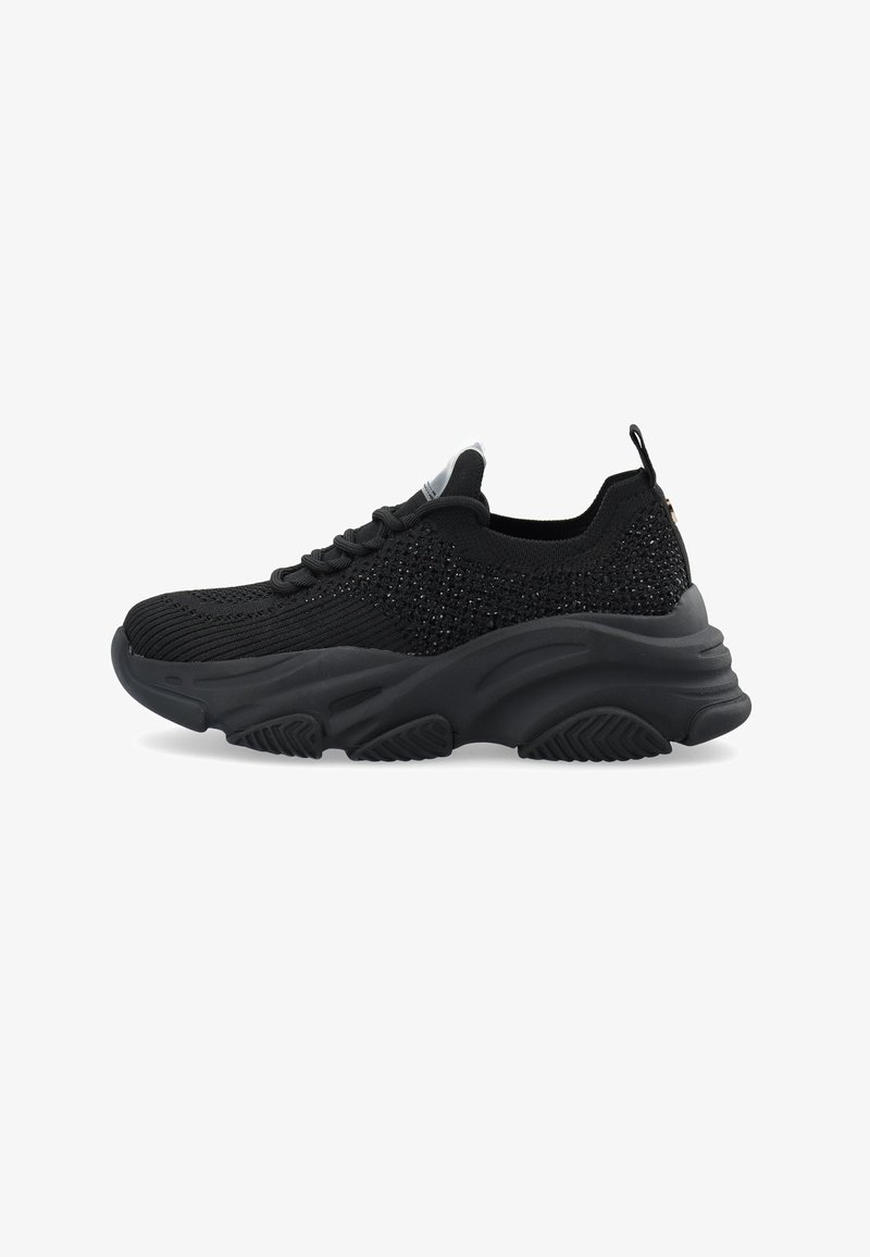 Black athletic shoes with a textured mesh upper, featuring metallic accents, a thick rubber sole, and a chunky silhouette.