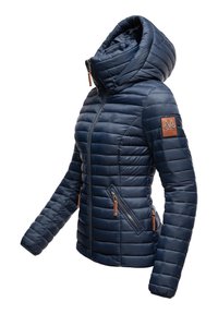 Navy puffer jacket with a high collar and hood, featuring quilted texture, two zippered pockets, and a leather logo patch on the sleeve.