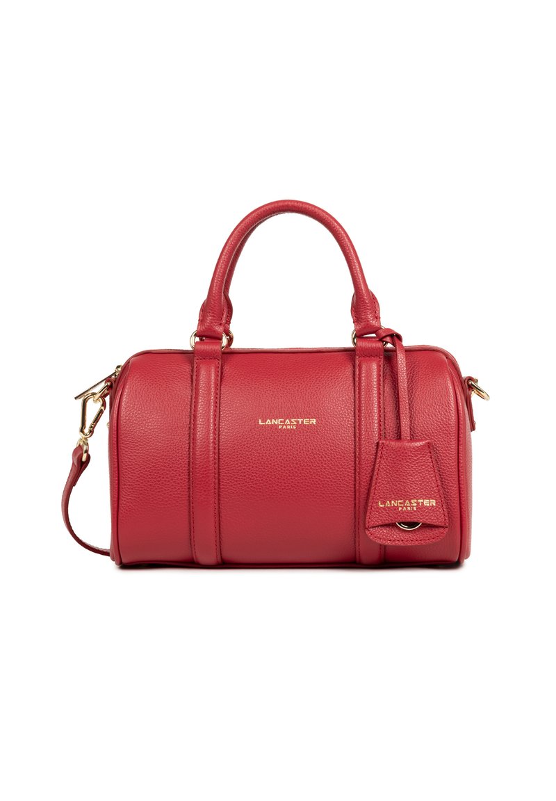 Red textured leather barrel handbag with double handles, detachable shoulder strap, and gold "Lancaster Paris" logo.