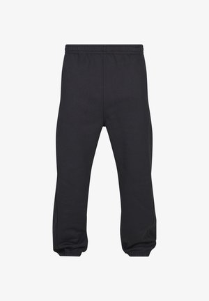 Černé teplákové kalhoty s elastickým pasem a elastickými lemy, vyrobené z měkké, hladké látky, zobrazené zepředu na plocho.