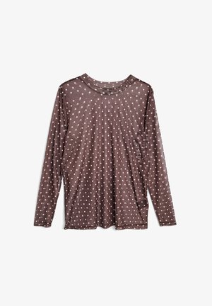 Brown long-sleeve top made of sheer fabric, featuring white polka dots, a round neckline, and a relaxed fit with side slits.