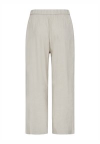 Pantalon beige clair à jambes larges avec taille élastique, en tissu léger, idéal pour un usage décontracté.