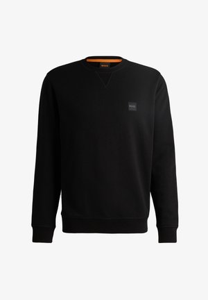 Mustmust mustrestitudest puuvilla segust, ümar kaelus, pikad varrukad, ribaga mansetid ja väike logoplekk rinnal.