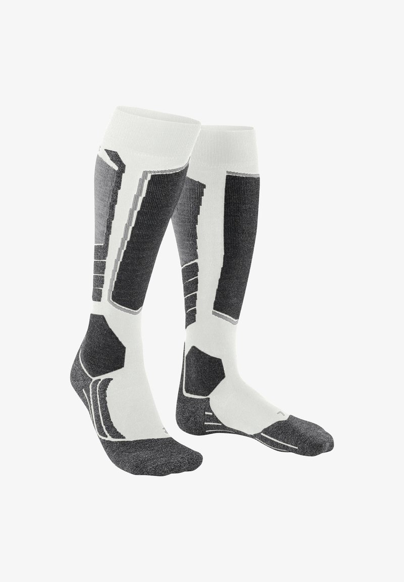 Calze compressive in bianco e grigio. Presentano motivi geometrici, texture a costine e zone rinforzate sulla punta e sul tallone per una maggiore durata.