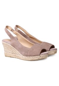 Beige suede wedge sandals with an open toe, slingback design, and jute-wrapped wedge heel. Features a smooth texture and minimal accents.