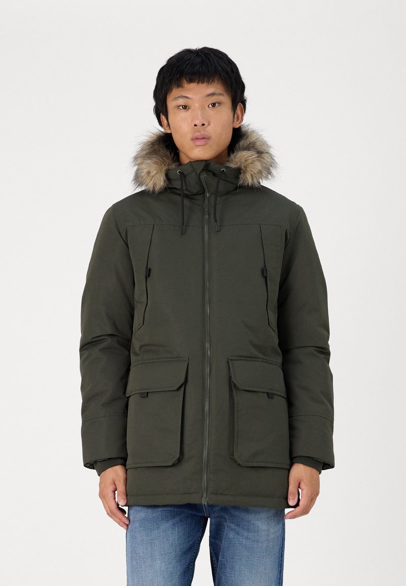 Olive green parka jacket with a fur-lined hood, zip closure, and two front pockets, made from a smooth, durable material.