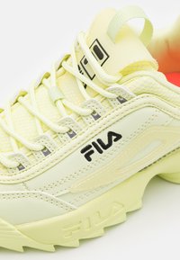 lime green fila disruptor