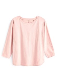 Top de manga larga rosa claro con un escote redondo y un ajuste relax. Fabricado en algodón suave, presenta una textura lisa y un diseño sencillo.