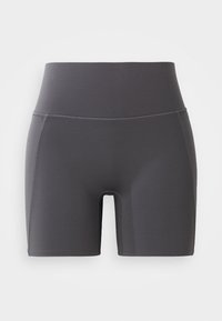 Shorts de sport gris avec une taille haute, fabriqués en tissu lisse et extensible. Dotés de coutures plates et d'un design ajusté.
