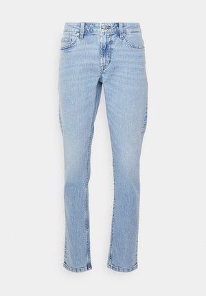 Svijetloplave traperice s ravnim nogavicama, klasičnog pet džepnog dizajna, s petljama za pojas i suptilnim izblijedjenjem. Nezavršeni rub na dnu.