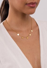 Goldkette mit fünf kleinen, rundlichen Scheiben, die gleichmäßig entlang der Kette verteilt sind. Das Design ist zart und hat eine polierte Oberfläche.