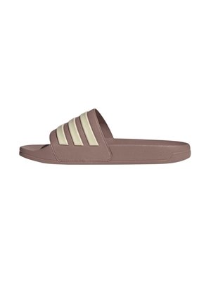 Brown slide sandal with three cream-colored stripes on the upper. Made of textured material, featuring a flat sole and open toe design.