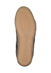 La semelle de la chaussure présente un design en caoutchouc avec un motif et une couleur marron clair. Les côtés sont de couleur sombre, probablement en tissu, avec des accents subtils.