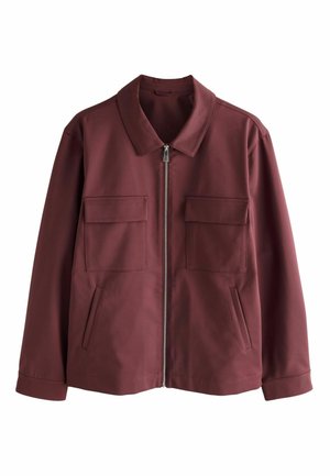 Burgundy jacket made of smooth fabric, featuring a pointed collar, front zip, two chest pockets, and side hand pockets.