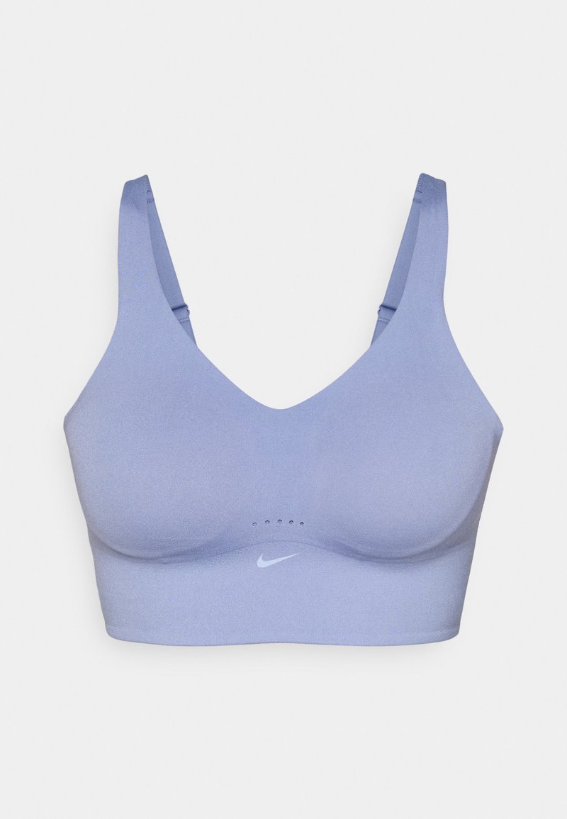 Light purple sports bra with smooth texture, deep V-neckline, wide straps, and Nike logo in white. Mesh panel details on the front.