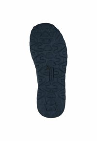 Black rubber outsole with a textured, rugged pattern for traction. Features molded detailing and a wide toe area.