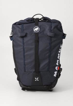 Navy blue backpack with grid pattern, black accents, top handle, adjustable straps, front logo, and side buckles for secure closure.