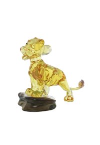 Kristallfigur av ett lejon i gult med en glänsande yta, detaljerade drag och en svart bas, som visar upp intrikata fasetterade texturer.