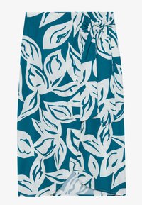 Teal skjørt med hvitt bladmønster, med innhyllet design og knyte detalj i livet. Glatt tekstur med en lett glans.