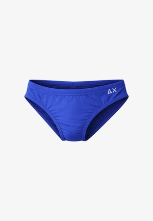 Costume da bagno da uomo blu con vita bassa e piccolo triangolo bianco con logo a "X" sul lato destro.
