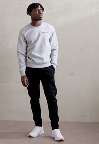 Champion ICONS HEM PANTS - Treniņtērpa apakšdaļas - black