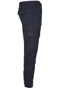 Navy cargo pants with a tapered fit, featuring multiple pockets and elastic cuffs. Made of lightweight fabric, offering a smooth texture.