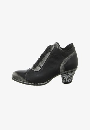 Black and metallic grey ankle boot with a rounded toe, textured leather, lace-up front, and a uniquely shaped block heel.
