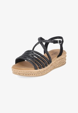 Schwarze Keilsandale mit Riemchen, funkelnden Riemchen, Knöchelriemen, gepolstertem braunem Fußbett und strukturierter, geschichteter beiger Sohle.