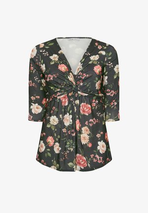 Tumma kukallinen kietaisupaita, jossa on vaaleanpunaisia ja valkoisia kukkia, kolmen neljänneksen hihat ja kierre solmu edessä.