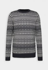 Pull en maille bleu marine avec des motifs géométriques et floraux blancs, avec un col rond et des poignets et un ourlet côtelés.