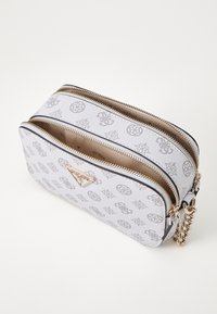 White leather bag with patterned gray logos, dual zippered compartments, and gold-tone hardware. Features a decorative chain accent.