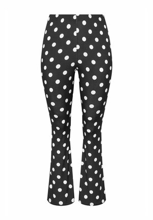 Schwarze eng anliegende Hose mit weißen Polka-Dots und leichtem Schlag am Saum.