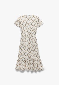 Vestido blanco con flores que presenta mangas cortas, una cintura elástica y un dobladillo con volantes. La tela es ligera y tiene una textura suave.