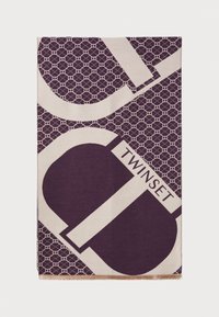 Écharpe violette et crème à motif, avec des designs géométriques et le mot "TWINSET", ornée de bords à franges. Le matériau semble doux et texturé.