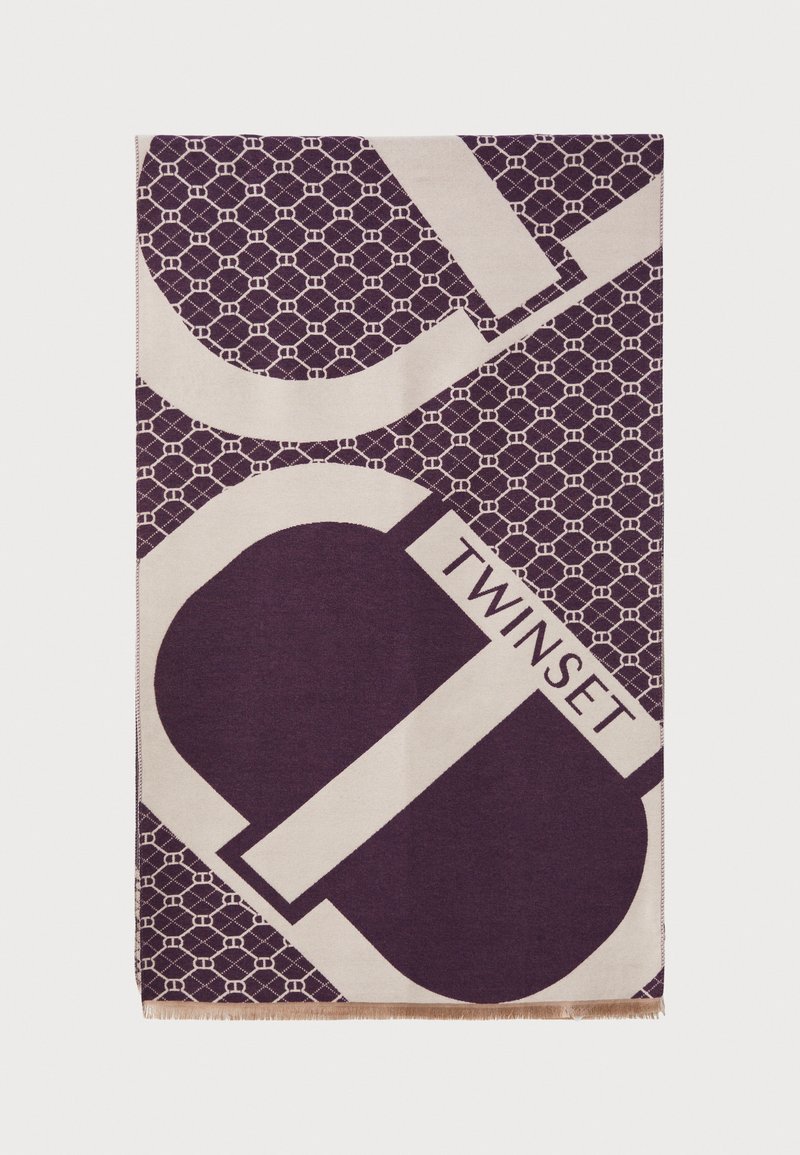 Écharpe violette et crème à motif, avec des designs géométriques et le mot "TWINSET", ornée de bords à franges. Le matériau semble doux et texturé.