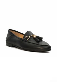 Black leather loafer featuring a rounded toe, a gold-toned hardware accent, and decorative black tassels. Smooth texture, low-profile sole.