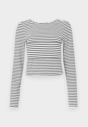 Top cu mâneci lungi, scurtat, cu un model în dungi alb-negru, cu decolteu rotund și material moale, texturat.